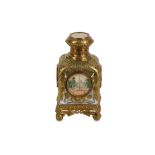 A 19TH CENTURY FRENCH GILT METAL AND CUT GLASS SCENT BOTTLE