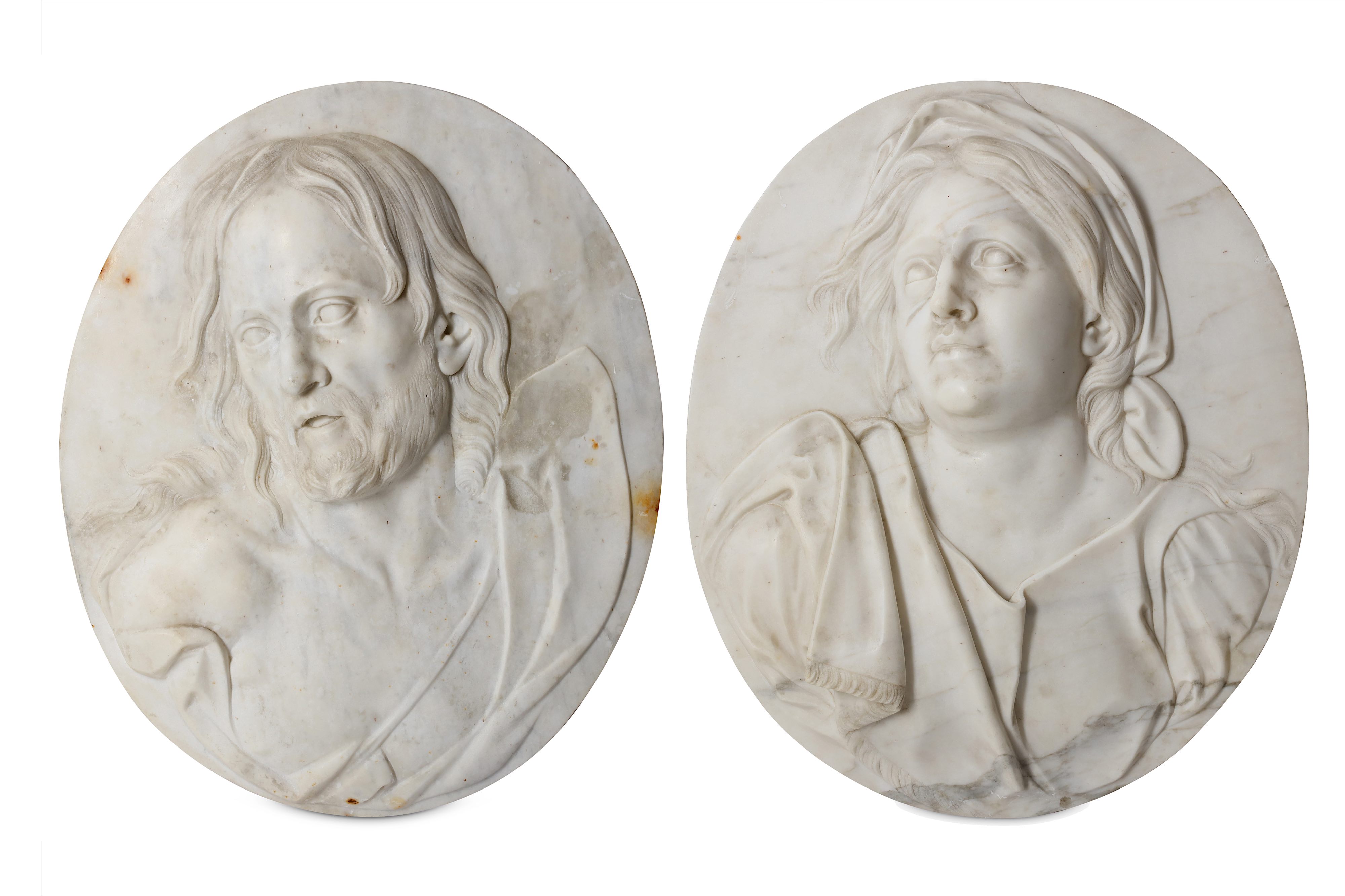 A PAIR OF ITALIAN 18TH CENTURY MARBLE RELIEFS DEPICTING CHRIST AND THE MOURNING VIRGIN IN THE MANNER