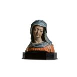 A LATE 15TH CENTURY FRENCH POLYCHROME LIMESTONE BUST OF THE VIRGIN
