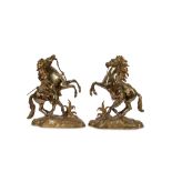 AFTER GUILLAUME COUSTOU THE ELDER (FRENCH, 1677-1746): A PAIR OF LATE 19TH CENTURY GILT BRONZE MODEL