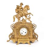 A French gilt metal cased mantel clock, surmounted by a figure of a horseman in 17th Century dress,