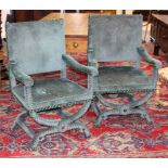 A pair of 17th Century style armchairs covered in green mottled velvet with studded decoration and