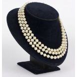 A three-row faux pearl necklace and bracelet, each with textured 18ct gold rectangular clasp, HJ Co.