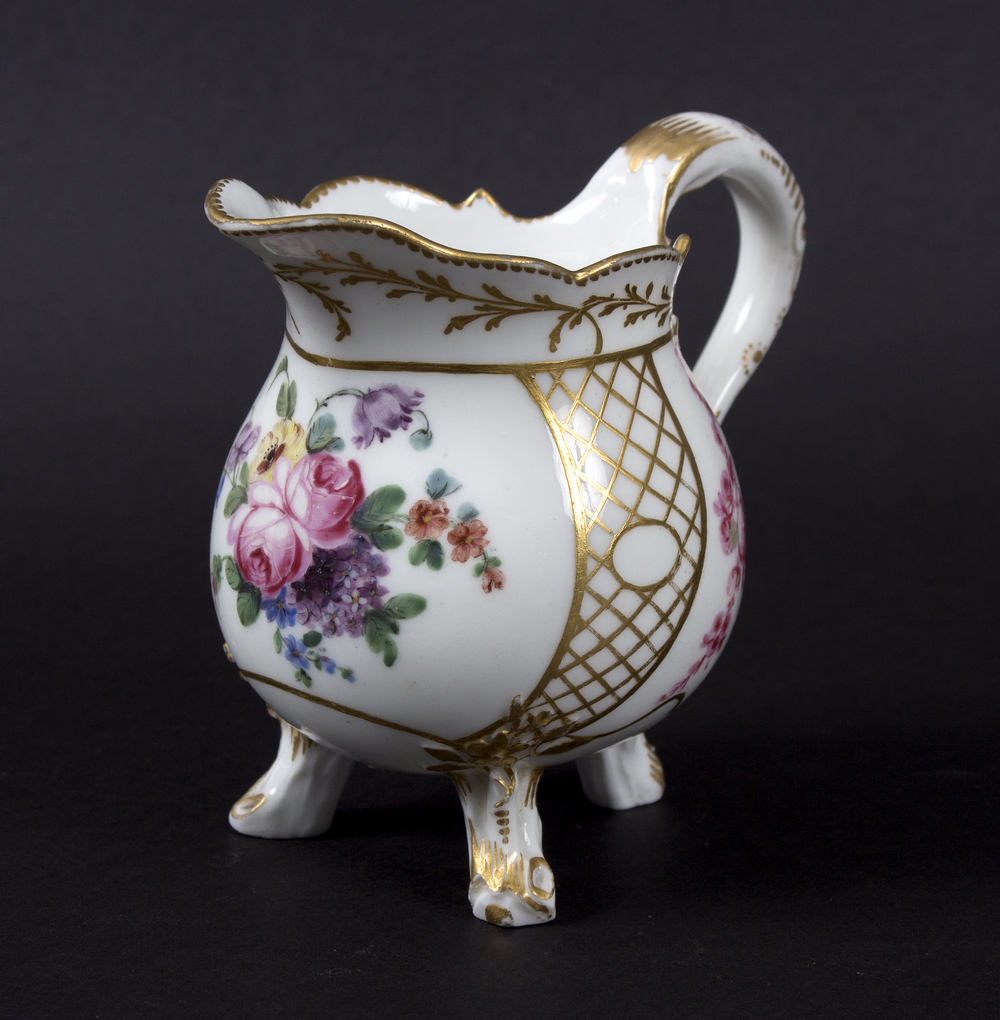 A Sèvres baluster cream jug, the porcelain 18th Century, gilding later,