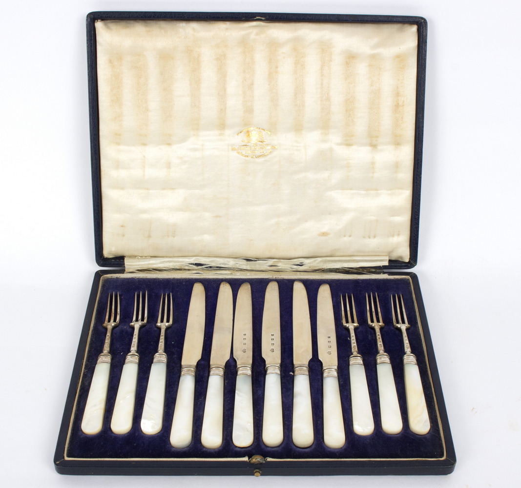 A set of six silver and mother-of-pearl fruit knives and forks, Goldsmiths & Silversmiths Co.