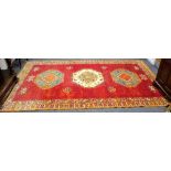 A 20th Century Moroccan red ground carpet,