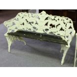 A fern pattern cast iron garden seat in the style of Coalbrookdale, with slatted wooden seat,
