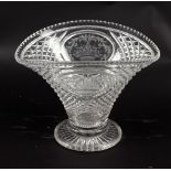 A cut and engraved glass vase, of basket form with opposing oval panels engraved flower baskets,