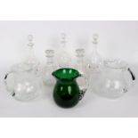 A group of glass decanters and jugs comprising a cut and engraved pair of decanters,