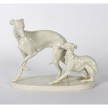 A Nymphenburg white glazed figure group of a whippet and puppy, 13.