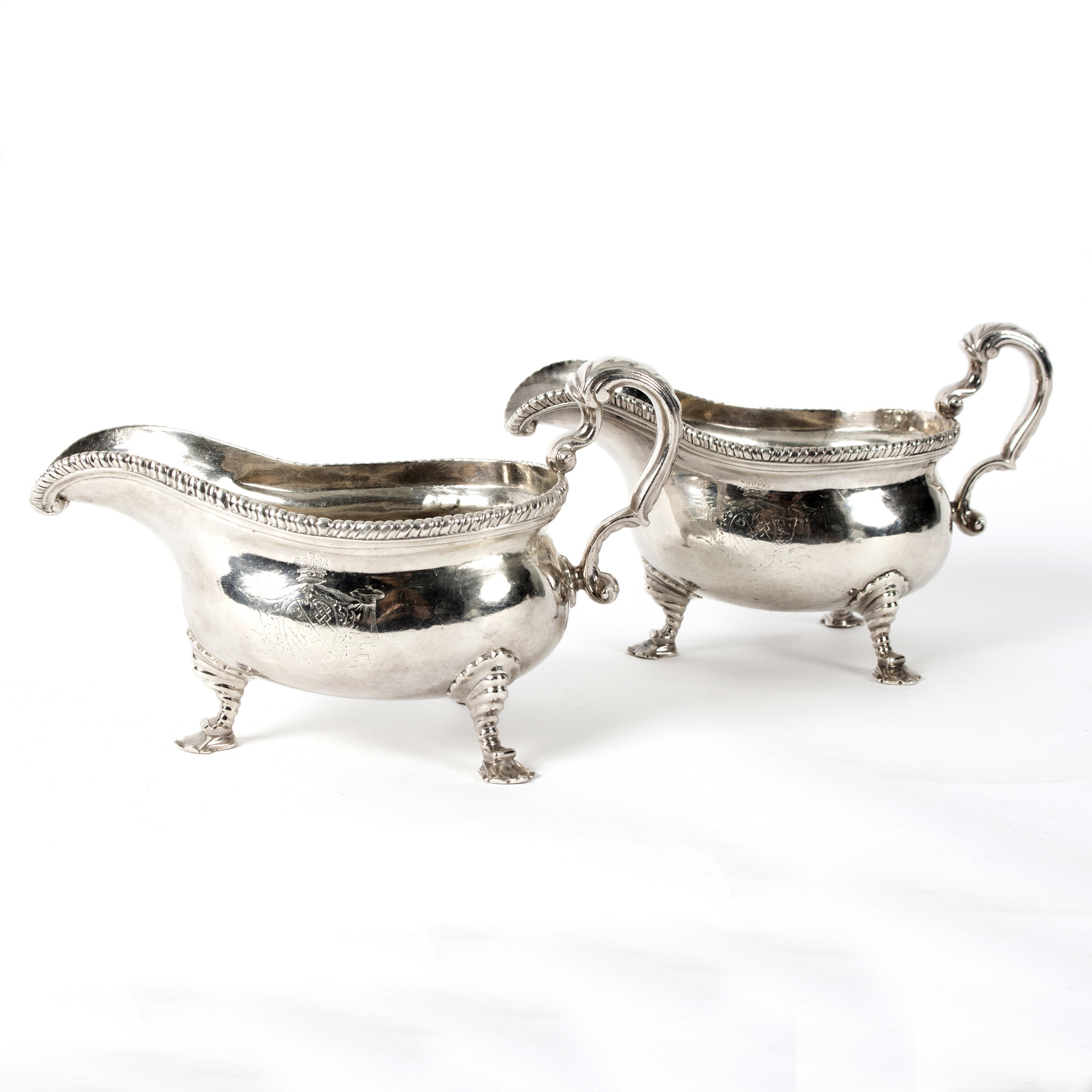 A pair of George II silver sauce boats, maker's mark rubbed, London 1754, each with gadrooned rim,
