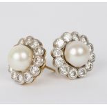 A pair of pearl and diamond cluster ear studs,