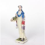 A Chelsea Cheyne figure of a lady with flower basket, incised mark, dated 1928,