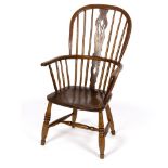 A stick back chair with elm seat on turned legs/Provenance: Beverston Castle