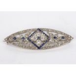 A Victorian sapphire and diamond brooch of elliptical shape centred by a flowerhead,