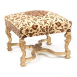 A giltwood stool with upholstered top,