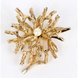 A brooch of naturalistic branch form with central pearl, marked Germany,