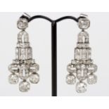 A pair of Art Deco diamond ear pendants, of geometric form set in unhallmarked white metal, 4.