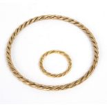 A 9ct gold bangle and matching ring of flattened rope twist form,