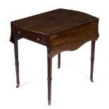 A mahogany Pembroke table of serpentine outline on moulded taper legs,