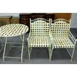 A set of white painted metal garden furniture with lattice seats and panels, comprising two chairs,