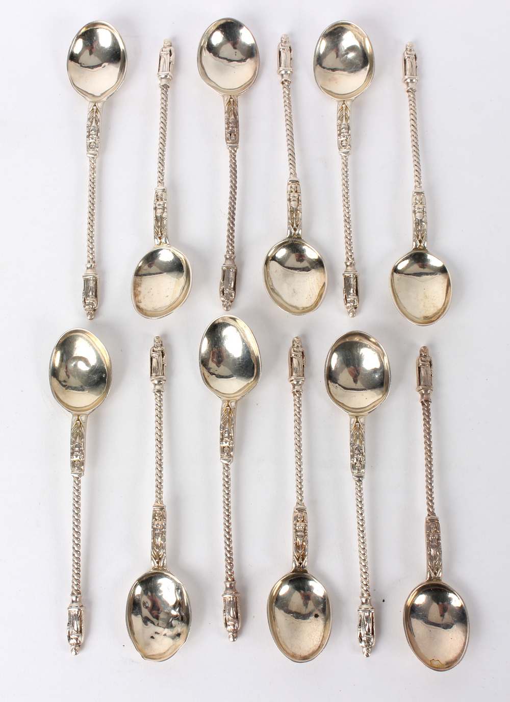 Twelve silver apostle top teaspoons, John & Frank Pairpoint, import marks for London 1879,