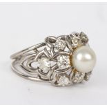 A diamond and pearl dress ring,