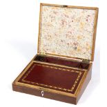 A Regency rosewood writing slope with crossbanded boxwood strung borders and fitted interior,