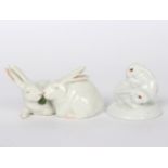 A Royal Copenhagen model of a seated fox, another of two rabbits and a Herend group of two rabbits,