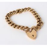 A 9ct yellow gold curb link bracelet with heart-shaped padlock clasp, approximately 44.