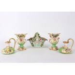 A group of green ground flower encrusted porcelain comprising a pair of Bloor Derby ewers, 14.