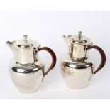A pair of silver lidded jugs, John Thomas Heath & John Hartshorne Middleton, Birmingham 1900,