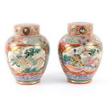 A pair of Japanese Kutani ginger jars and covers, circa 1900, painted reserves of exotic birds, 25.