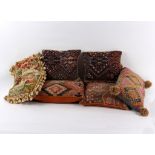 Two pairs of kelim covered cushions and two other cushions