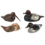 Four carved and painted wooden duck decoys,