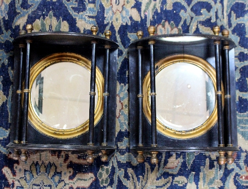 A pair of mirror back brackets with turned supports,