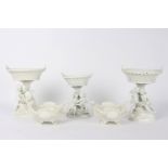 Three white Dresden comports, late 19th Century, with pierced oval basket pattern tops,