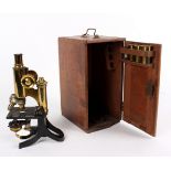 A gilt brass microscope by J Swift & Son London,