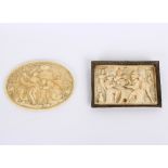 A 18th Century French carved ivory oval plaque with figures on a terrace, 9.