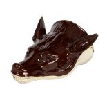 A brown glazed creamware fox mask stirrup cup, circa 1780,