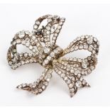 A Victorian diamond bow brooch, possibly adapted, one stone missing, 6cm wide,