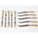 A set of five pairs of bone handled knives and forks of Turkish yataghan style inlaid in various
