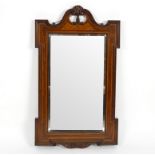 A rosewood and inlaid mirror, with swan neck cresting and outset corners, bevelled glass, 72cm x 41.