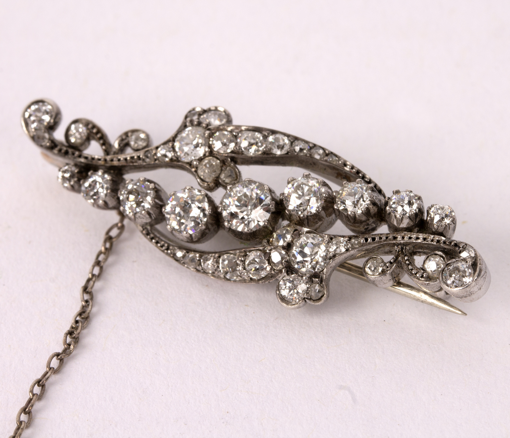 A diamond brooch of scrolling form, - Image 3 of 3