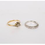 A five-stone diamond ring set in 14k white gold,