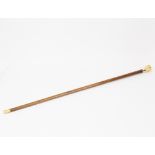 A Victorian malacca walking cane with ivory handle,