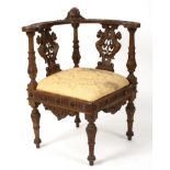 A 19th Century oak library chair profusely carved all over, bearing a label Frères Besarel,