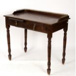 A 19th Century walnut side table, with galleried top above a slide and a drawer,