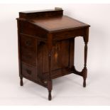 An Edwardian rosewood and inlaid Davenport, with stationery compartment to the back,