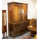 A 19th Century mahogany linen press, the upper section enclosed by crossbanded panel doors,